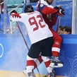 GANGNEUNG, SOUTH KOREA - FEBRUARY 24: The Czech Republic's Lukas Radil #69 take a hit from Canada's Christian Thomas #92 during bronze medal game action at the PyeongChang 2018 Olympic Winter Games. (Photo by Andre Ringuette/HHOF-IIHF Images)

